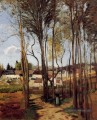 un village à travers les arbres Camille Pissarro